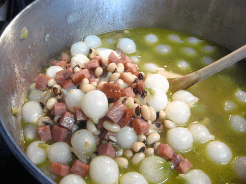 Simmering the black eyed peas soup.