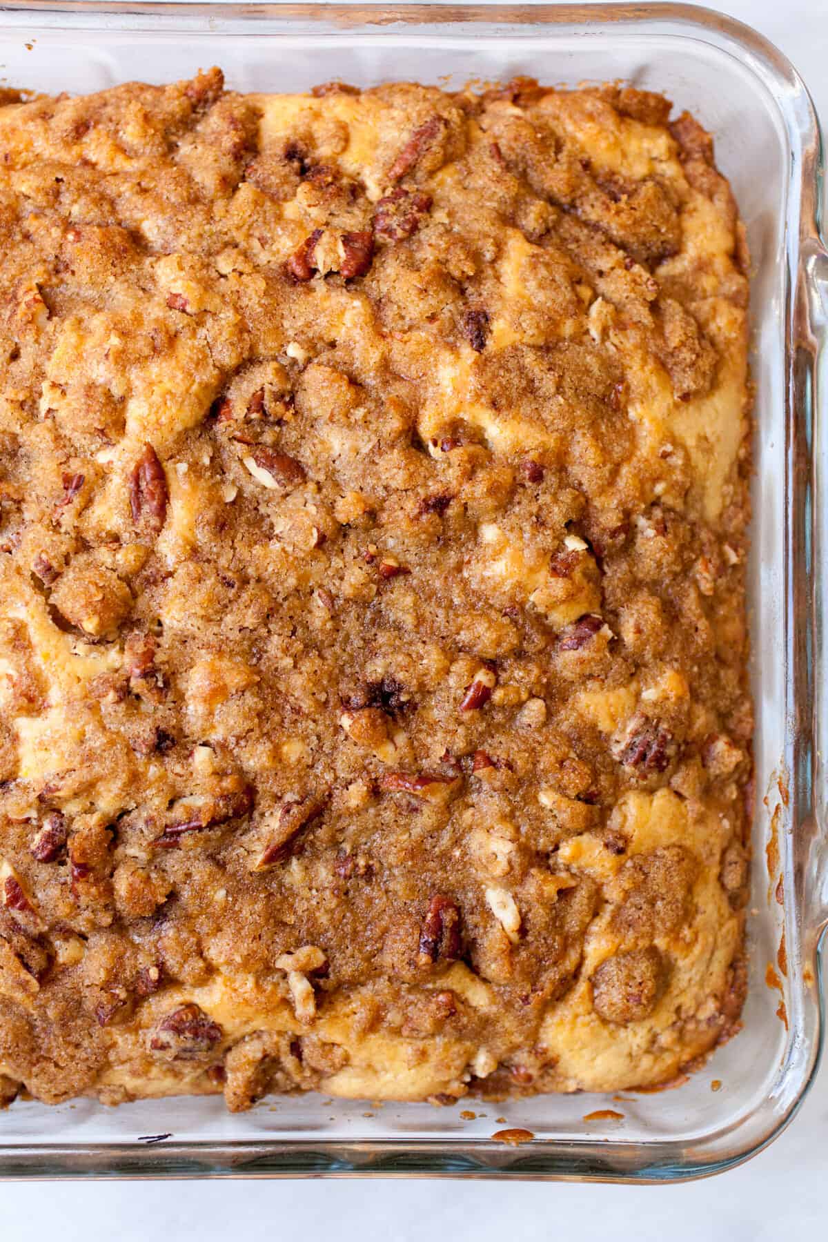 Orange Coffee Cake: Delicious coffee cake with a crunchy crumb topping and laced with citrus flavors. Perfect with tall cup of coffee or just have a slice for dessert! | macheesmo.com