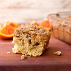Orange Coffee Cake: Delicious coffee cake with a crunchy crumb topping and laced with citrus flavors. Perfect with tall cup of coffee or just have a slice for dessert! | macheesmo.com