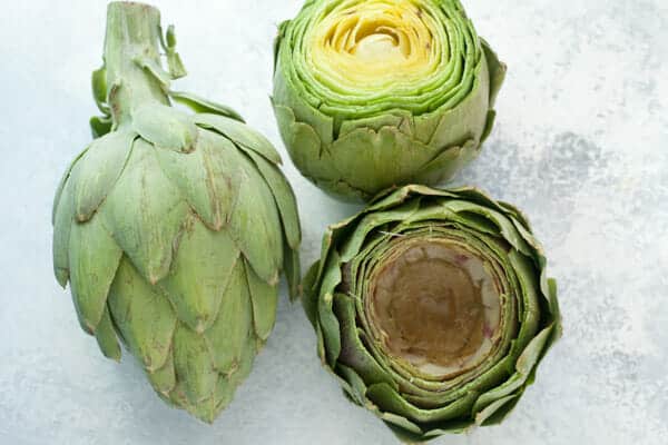 Prepping the artichokes for stuffing.