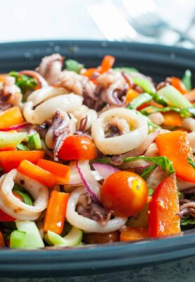 Calamari Salad: Loads of fresh vegetables tossed with quick-seared calamari makes for a delicious and light seafood salad. | macheesmo.com