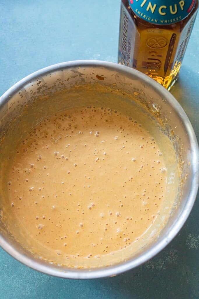 Mixing the filling for pumpkin cheesecake.