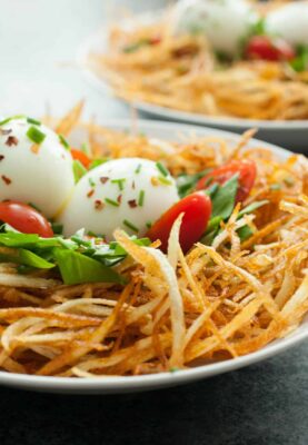 Bird's Nest BreakfastS: Thin fried slivers of potato layered with a few veggies and soft-boiled eggs. A fun and very delicious breakfast! | macheesmo.com