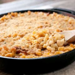 Cast Iron Macaroni and Cheese: A made-from-scratch mac and cheese with just enough bacon and spice, mixed together and baked in a cast iron skillet for crispy edges!