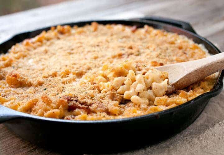 Cast Iron Macaroni and Cheese: A made-from-scratch mac and cheese with just enough bacon and spice, mixed together and baked in a cast iron skillet for crispy edges!