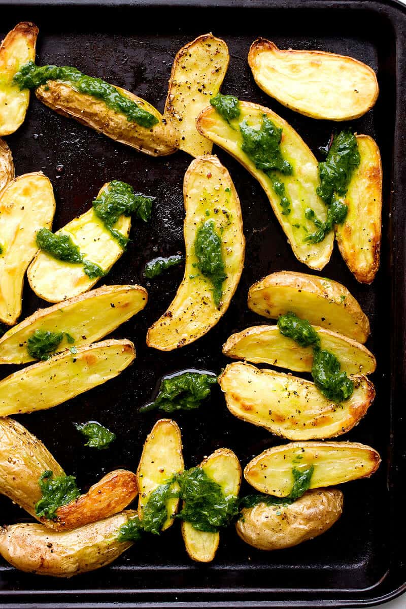 Roasted Fingerlings with Chive Pesto: Crispy roasted fingerling potatoes (they cook quickly) tossed with a simple chive pesto - packed with flavor! This is the side dish that potato lovers will have dreams about. | macheesmo.com