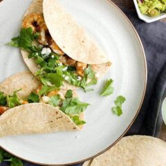 Margarita Shrimp Tacos: Tacos don't have to be heavy! These citrus and tequila marinaded shrimp are light and zesty and perfect for a fresh Tex-Mex dinner. Don't skimp on the guacamole! | macheesmo.com