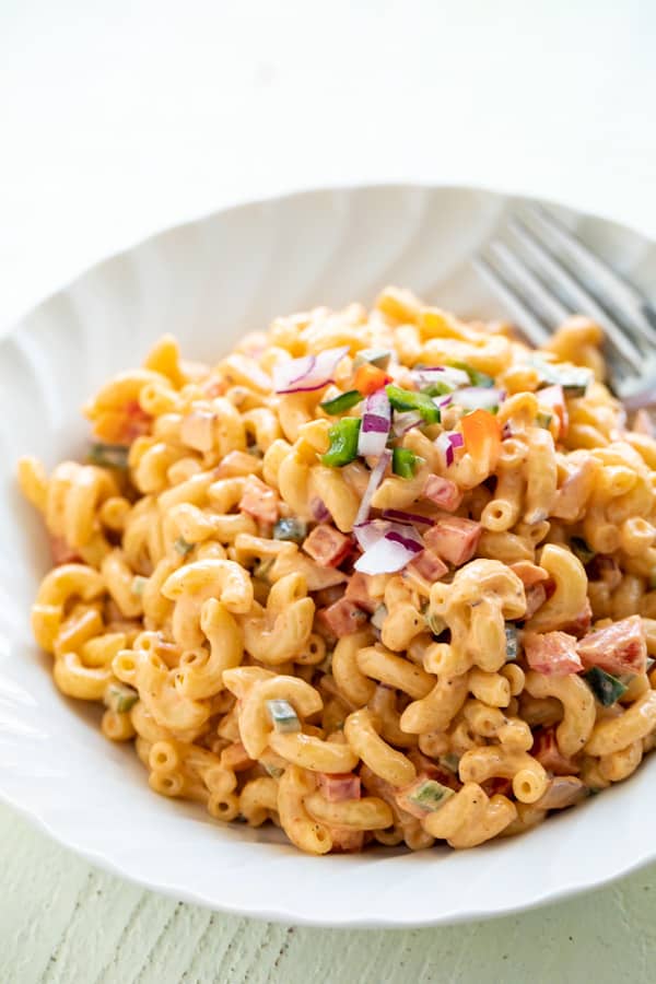 Spicy Macaroni Salad in a white bowl.