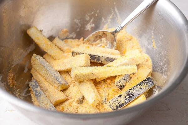 Eggplant fries tossed with breading.