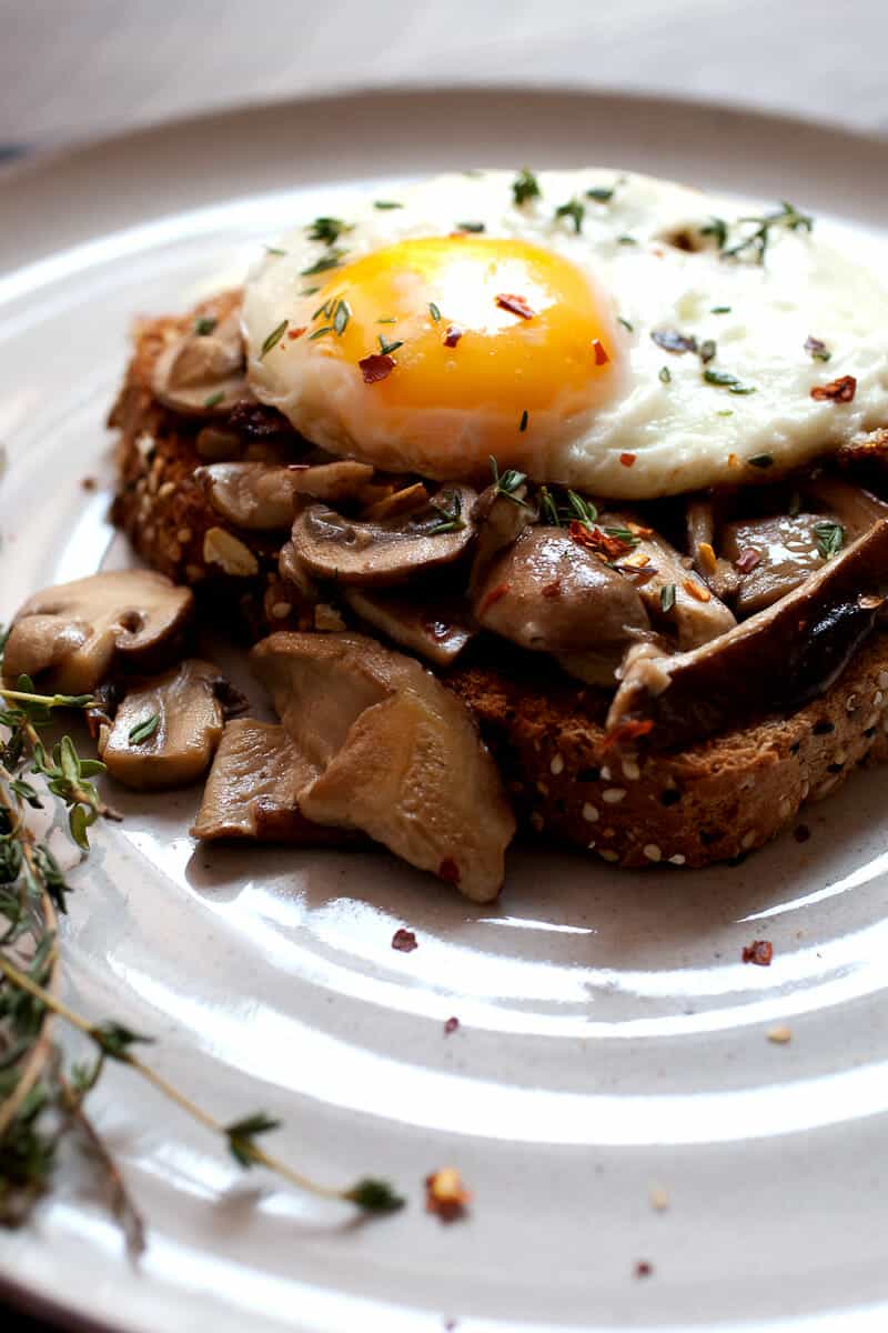 Creamed Mushrooms on Toast: One of my favorite simple breakfasts. Good hearty mushrooms, simply sauteed in olive oil with a few spices and simmered in a little cream. Piled onto sturdy toast with a few eggs! | macheesmo.com
