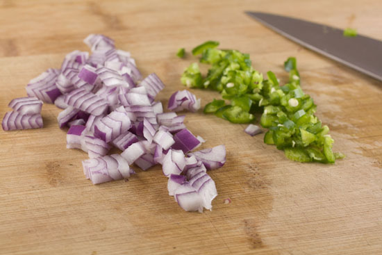 chopping veggies for Breakfast Nachos