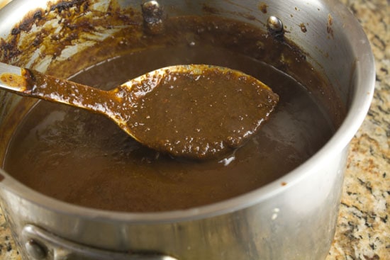 stirring homemade mole sauce
