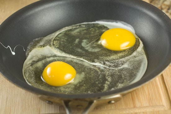 eggs cooking in pan for Ricotta Breakfast Sandwich