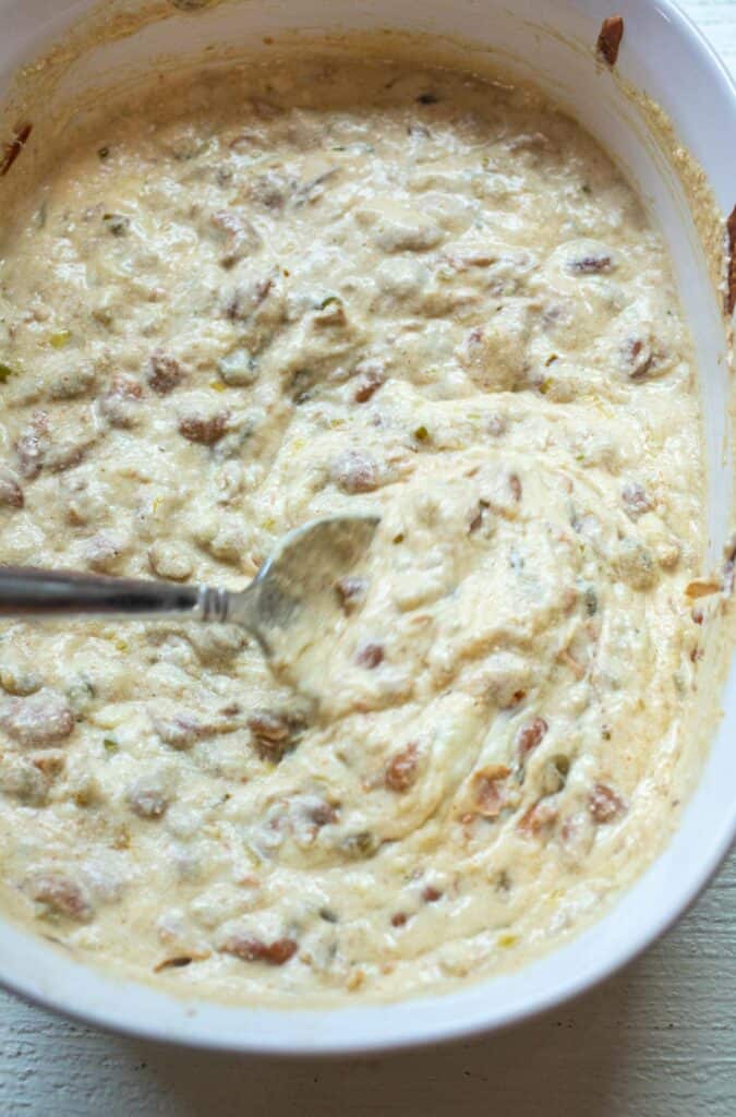 Baked queso dip stirred together.