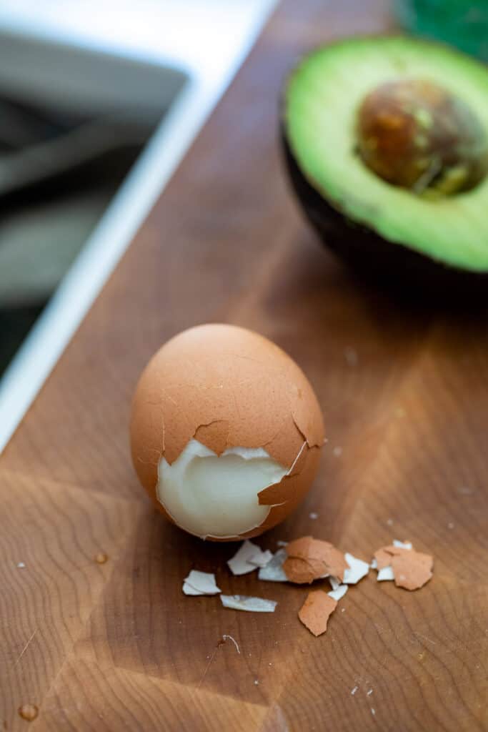 Peeling soft-boiled eggs.