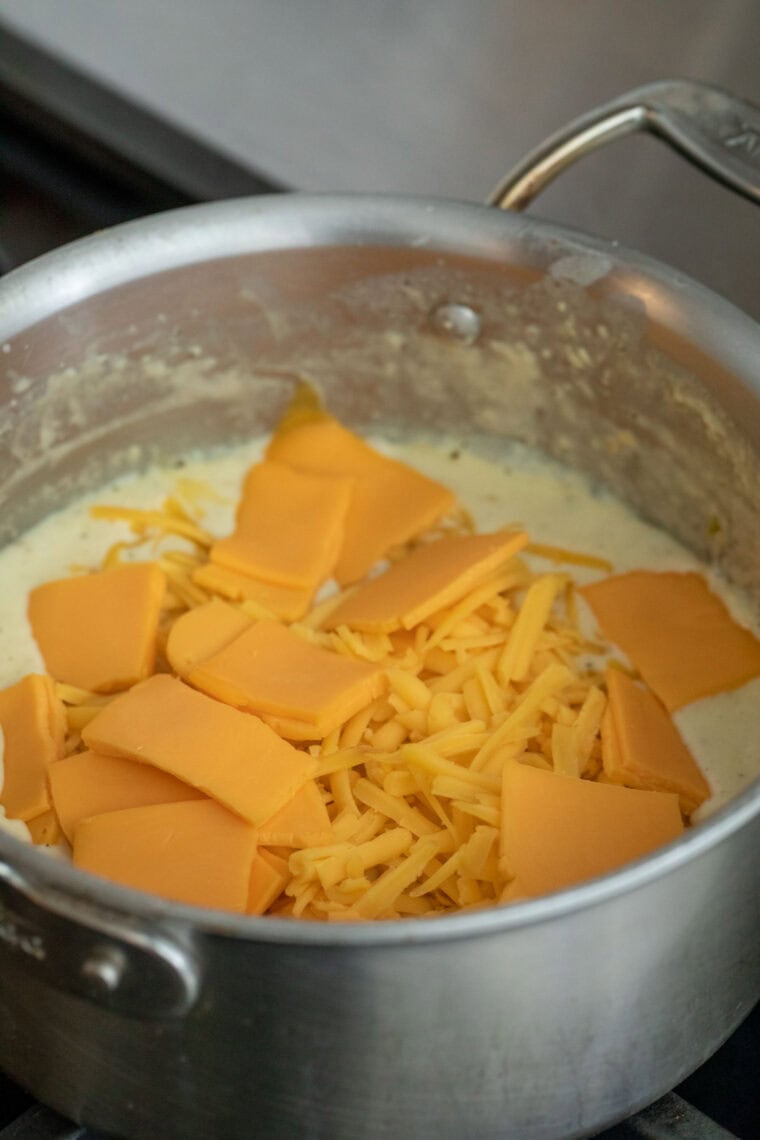 Adding cheese to roux.