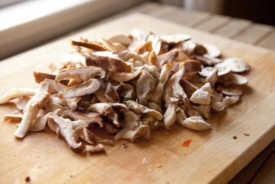 Sliced various mushrooms for soup.