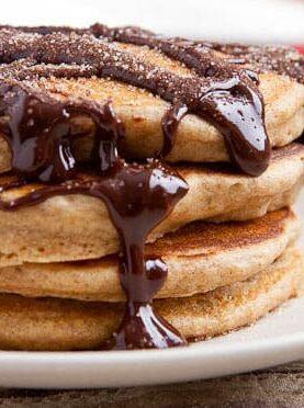 Churro pancakes with spicy chocolate sauce.