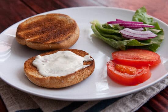 Fixings on a burger bun.