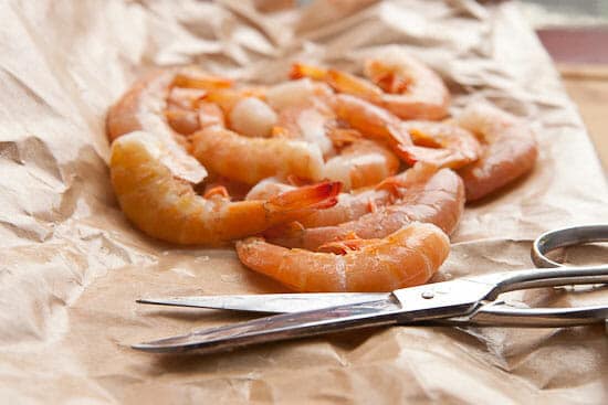 Cleaning shrimp for steaming.