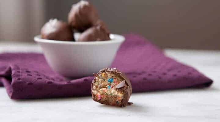 Funfetti Cookie Dough Truffles made with a safe-to-eat no bake cookie dough! These are so addictive and good. The perfect holiday sweet snack.