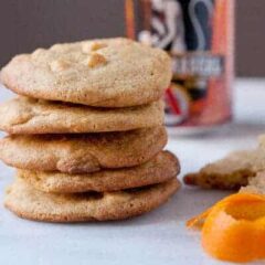 Orange White Chocolate Cookies - Packed with chocolate chips and orange zest and seasoned with a reduced white ale honey. Be sure to check out the secret spice that takes these cookies over the edge!