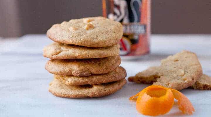 Orange White Chocolate Cookies - Packed with chocolate chips and orange zest and seasoned with a reduced white ale honey. Be sure to check out the secret spice that takes these cookies over the edge!