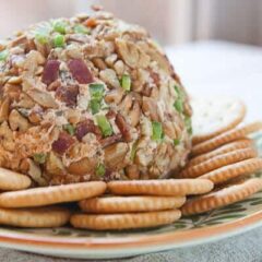 This simple jalapeno popper cheese ball is jam-packed with fantastic flavors including roasted jalapeno peppers and crispy bacon! crunchtimekitchen.com #cheeseball #jalapenos #poppers