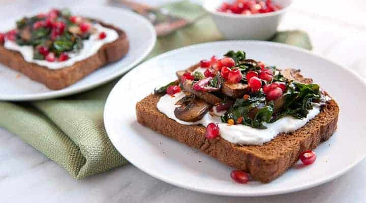 Savory Mushrooms on Toast: Sauteed mushrooms and Swiss chard served over crispy pumpernickel toast with some bonus goodies packed on!