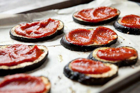 Eggplant rounds sauced.