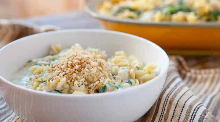 Spinach Artichoke Fusilli: A delicious, creamy no-bake pasta jam-packed with fresh spinach and artichokes. Topped with spicy buttery breadcrumbs!