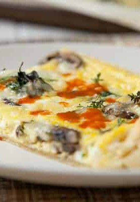 Puff Pastry Frittata: An easy breakfast dish packed with mushrooms and spinach and baked in a sheet pan. The finished dish is nice and thin and has a great crust!