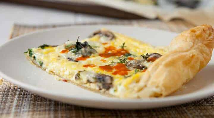 Puff Pastry Frittata: An easy breakfast dish packed with mushrooms and spinach and baked in a sheet pan. The finished dish is nice and thin and has a great crust!