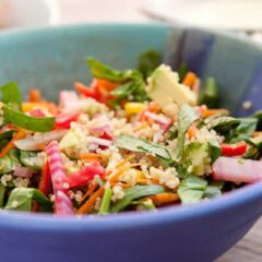 Quinoa Spinach Salad! This is my big reset salad after a weekend of unhealthy eating. Fluffy quinoa, chopped spinach, roasted beets, and other crunchy veggies and a spicy yogurt dressing!