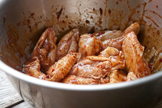 Sticky chicken wings tossed in sauce