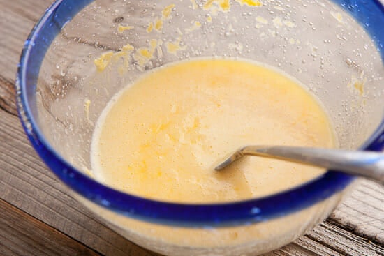 Whisking the eggs for the carbonara sauce.
