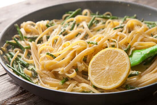 Lemon asparagus carbonara in a skillet.