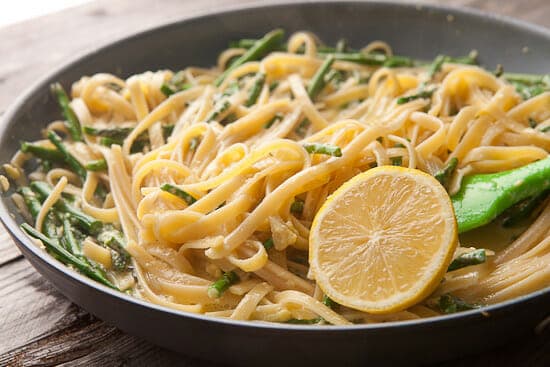 Lemon asparagus carbonara in a skillet. 