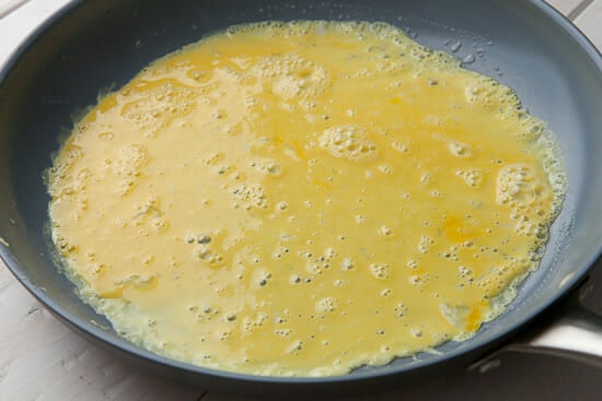 Breakfast pinwheel eggs cooking.