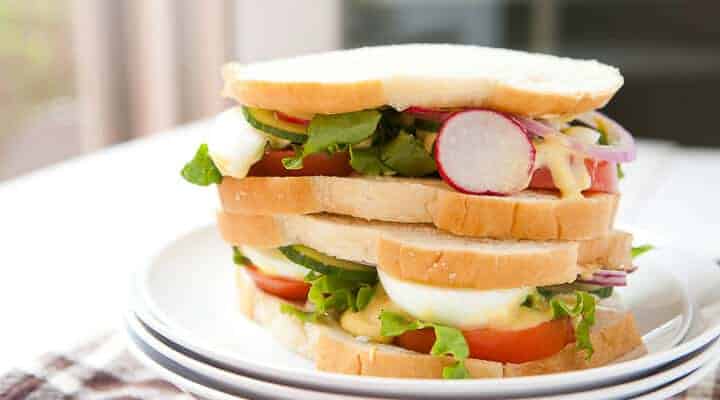 Summer Salad Sandwiches: Soft white sandwich bread, all the crunchy, crispy veggies of summer, and a lightly tangy salad cream dressing makes for one great sandwich! From 