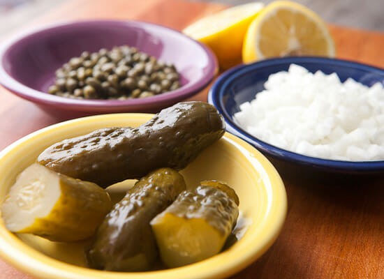 Ingredients in bowls for tartar sauce.