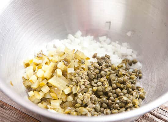 Dicing up ingredients for homemade tartar sauce.