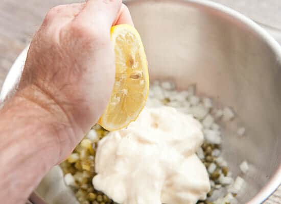 Mixing up the tartar sauce.