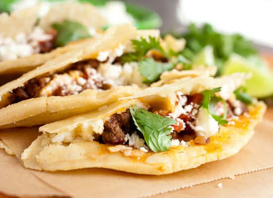 Fried tacos with queso fresco and beef filling.