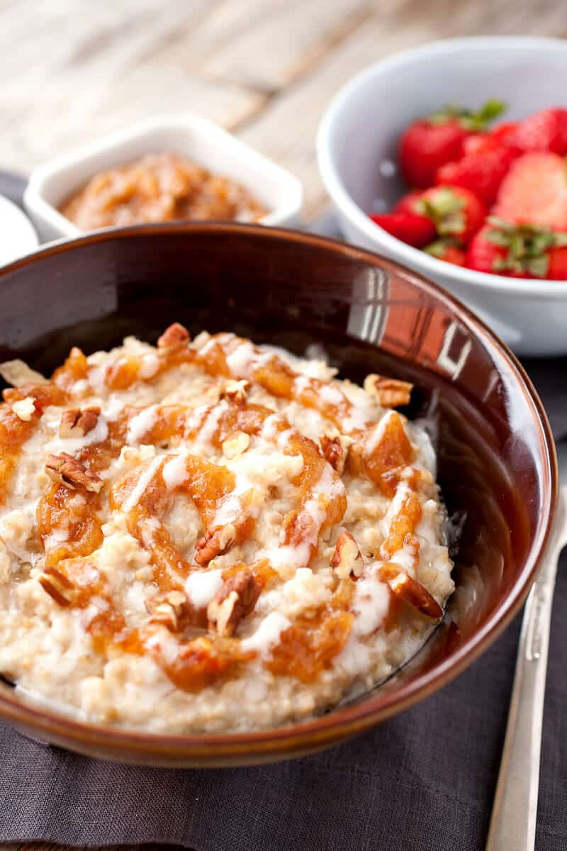Date Cinnamon Roll Oatmeal Bowls: Steel-cut oatmeal slow-simmered with cinnamon and vanilla and topped with two perfect cinnamon roll toppings. Instead of just brown sugar though, I like to use dates! | macheesmo.com