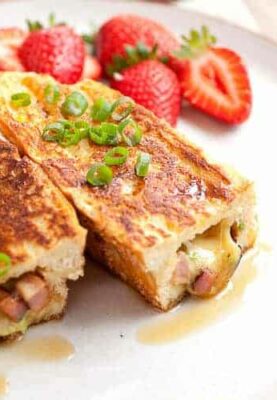 Savory Stuffed French Toast! This is the French toast of your dreams. The perfect mix of savory and sweet smashed together in thick pieces of French bread. So delicious and trust me when I say it's easier than it looks to make! | macheesmo.com