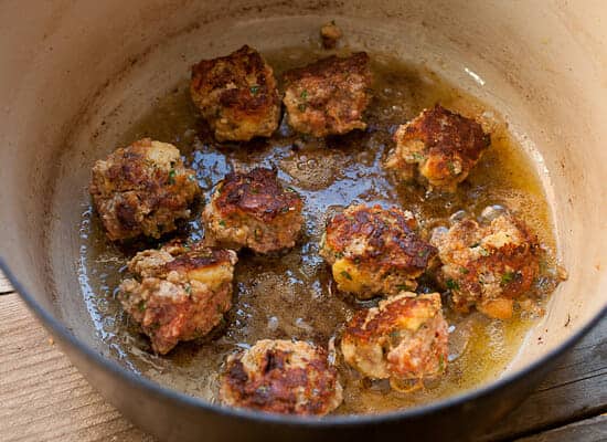 Browning meatballs in a Dutch oven.