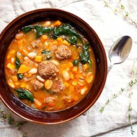 One Pot Chorizo Yam Stew: This is one of the most flavorful stews you'll make this year and everything just goes in one pot! The order is important though! Chorizo, yams, white beans, spinach. Perfect for winter! | macheesmo.com