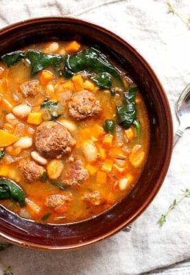 One Pot Chorizo Yam Stew: This is one of the most flavorful stews you'll make this year and everything just goes in one pot! The order is important though! Chorizo, yams, white beans, spinach. Perfect for winter! | macheesmo.com