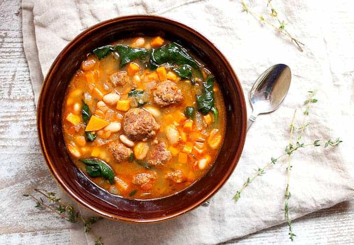 One Pot Chorizo Yam Stew: This is one of the most flavorful stews you'll make this year and everything just goes in one pot! The order is important though! Chorizo, yams, white beans, spinach. Perfect for winter! | macheesmo.com